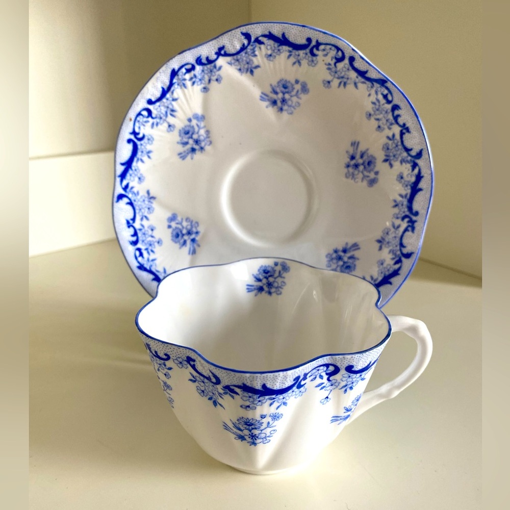 EUC VTG SHELLEY BONE CHINA TEACUP AND SAUCER IN “HEAVENLY BLUE” PATTERN